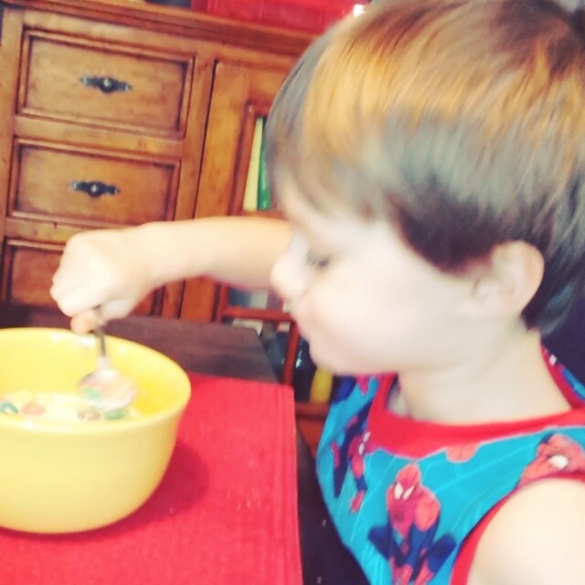 Happily eating cereal.