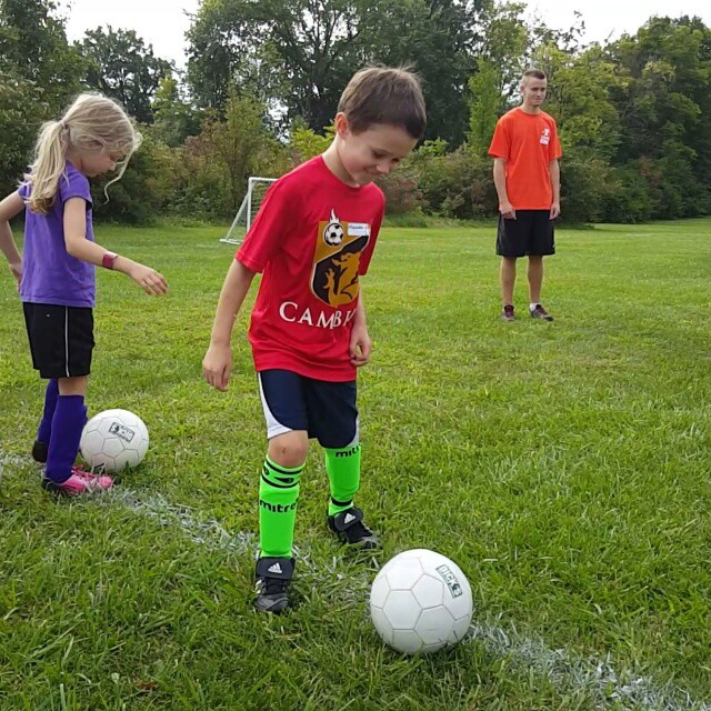 Soccer is fun, but kisses from mom are better.