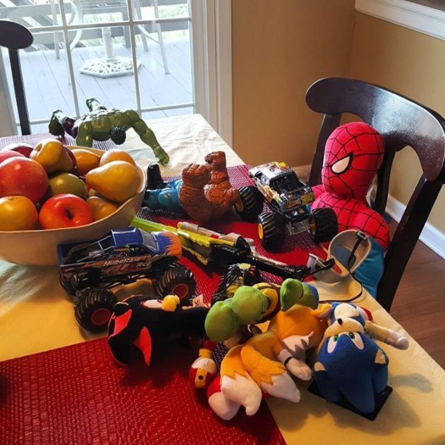 Not exactly sure how this happens. They don't arrive at once. It's just one toy at a time until - all of a sudden - the table's covered in toys and Spiderman's to blame.